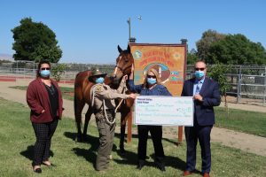 Prison staff and a horse.