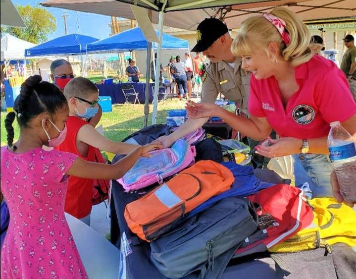 Ironwood prison staff hand out school supplies.