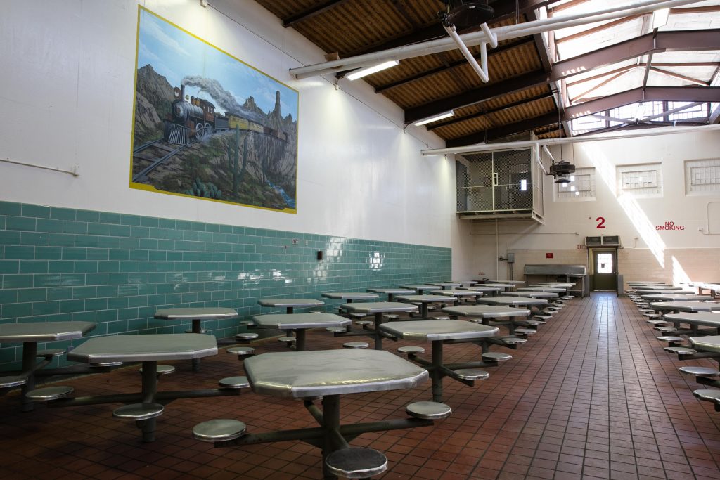DVI prison dining hall with mural.