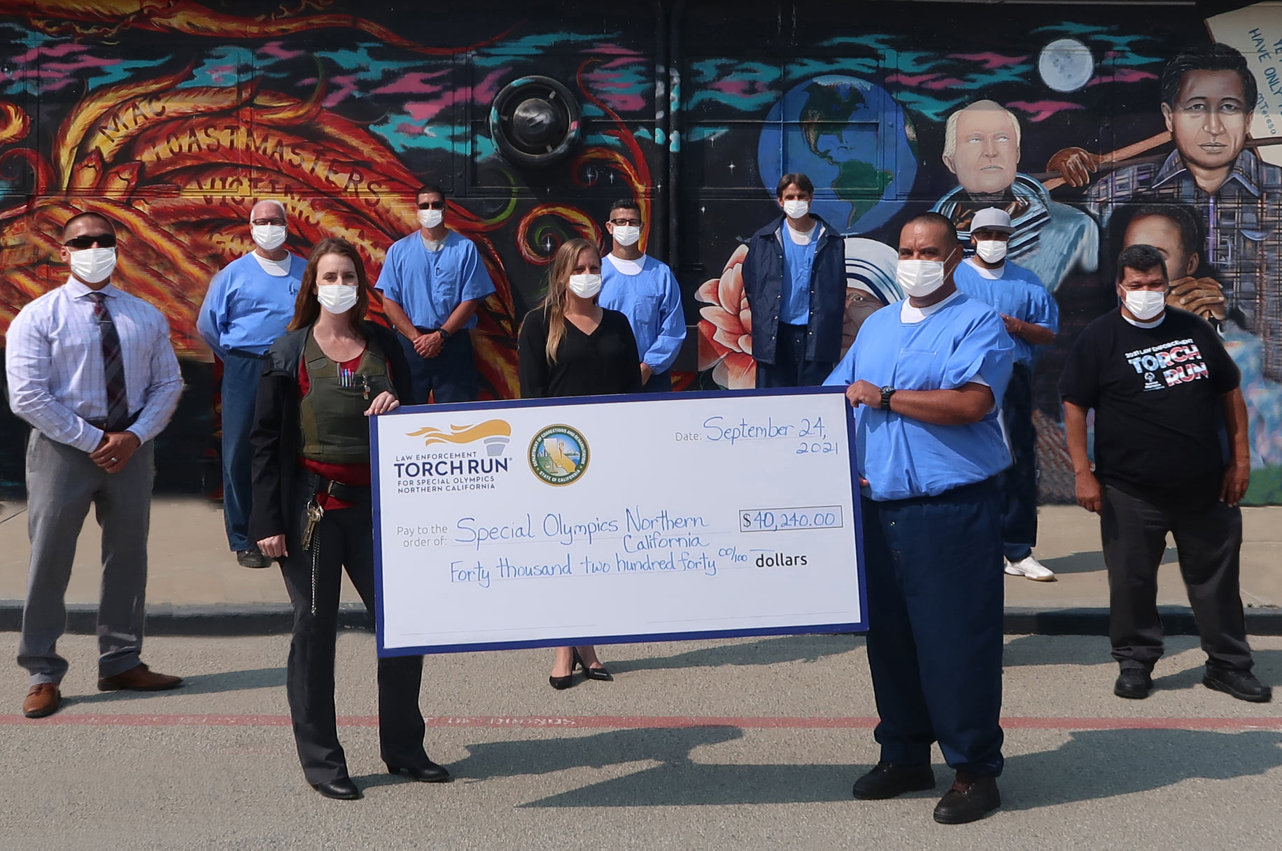 CTF inmates present a donation to Special Olympics.