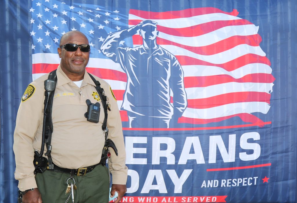 SATF veterans day banner and correctional officer