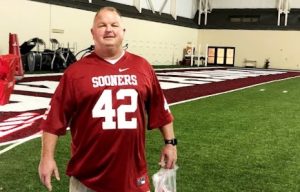 Officer Cordell wearing football jersey.
