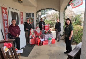 CAC staff and gifts at a group home.