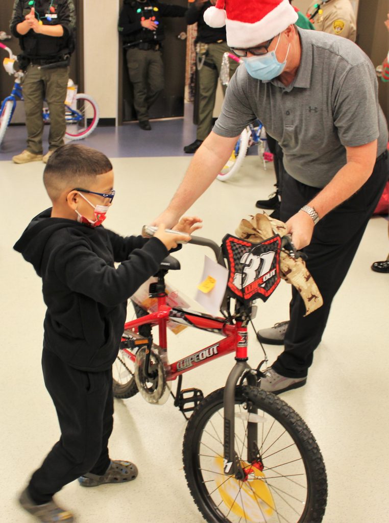 Child receives a bicycle.