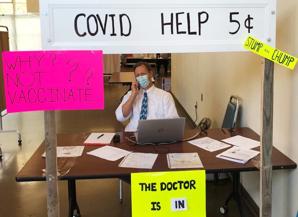 CDCR booth with "Doctor is in" sign similar to Lucy in the Peanuts cartoon.