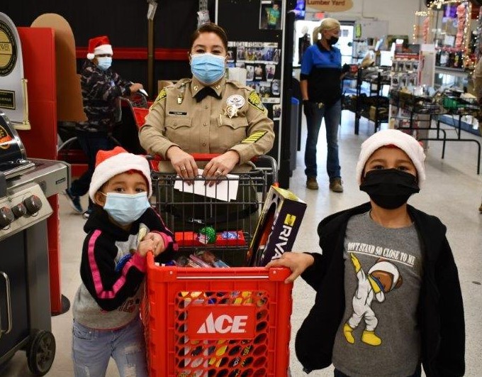CDCR captain and two children shop for presents.