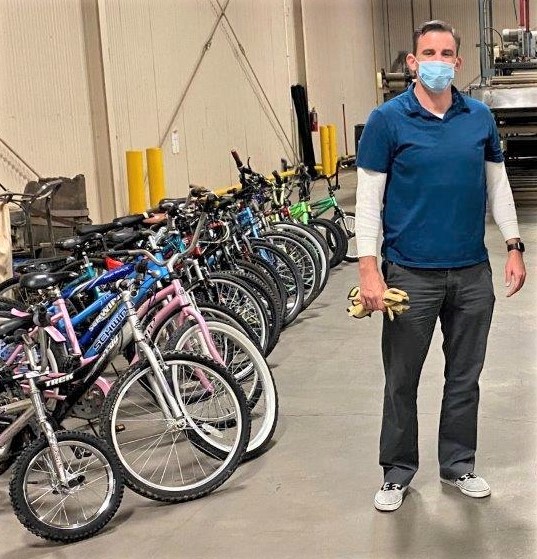 Clovis staff member and donated bicycles.