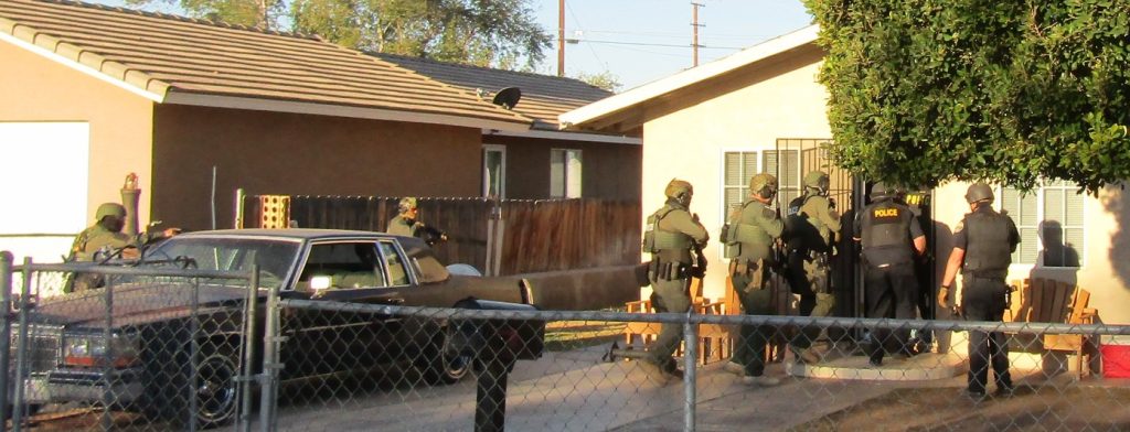 CDCR, police serve search warrants on a house.