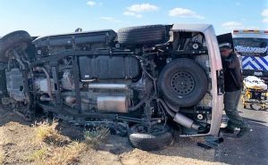 CDCR K-9 officers help at an overturned vehicle accident.