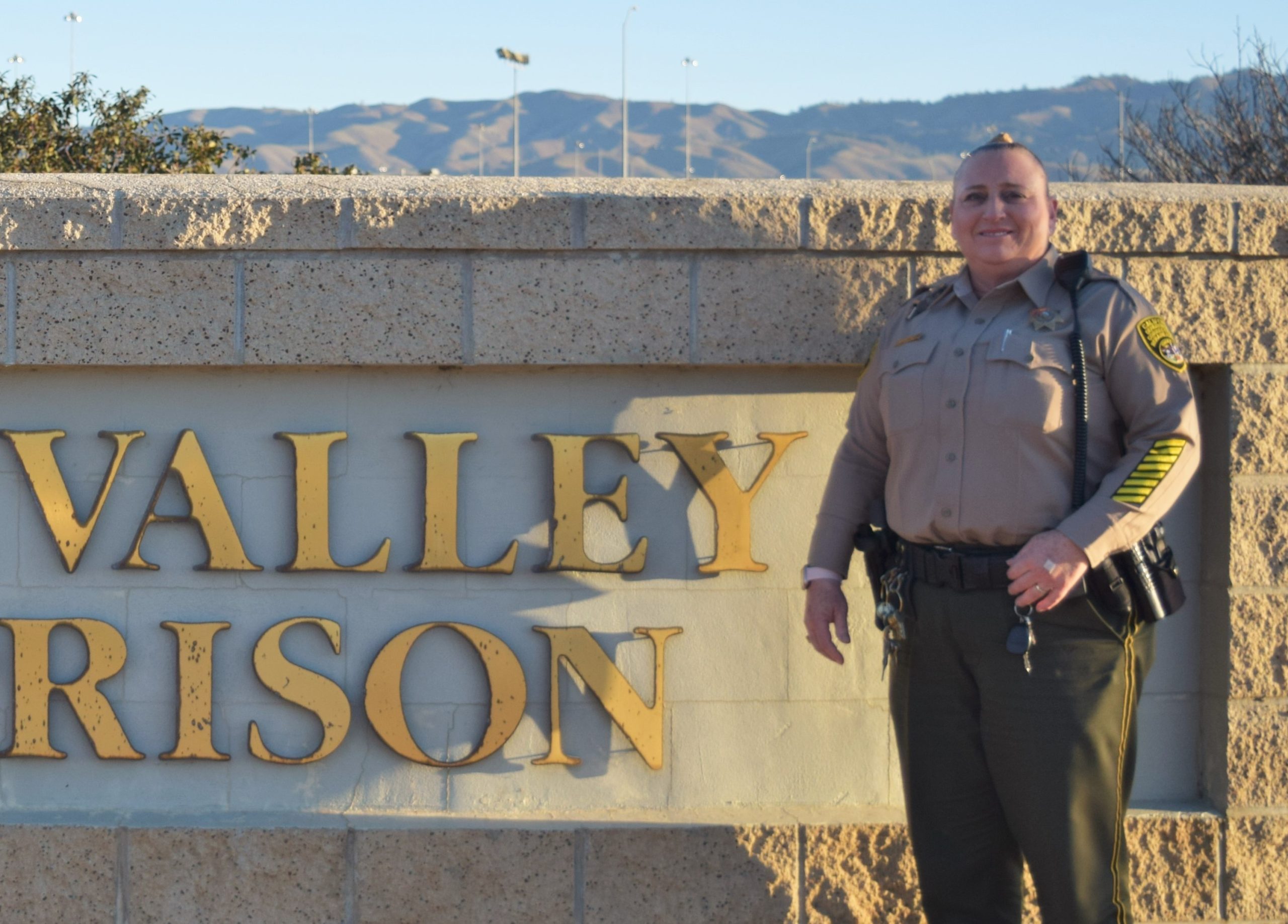 Correctional officer Lonero at Salinas Valley State Prison sign.