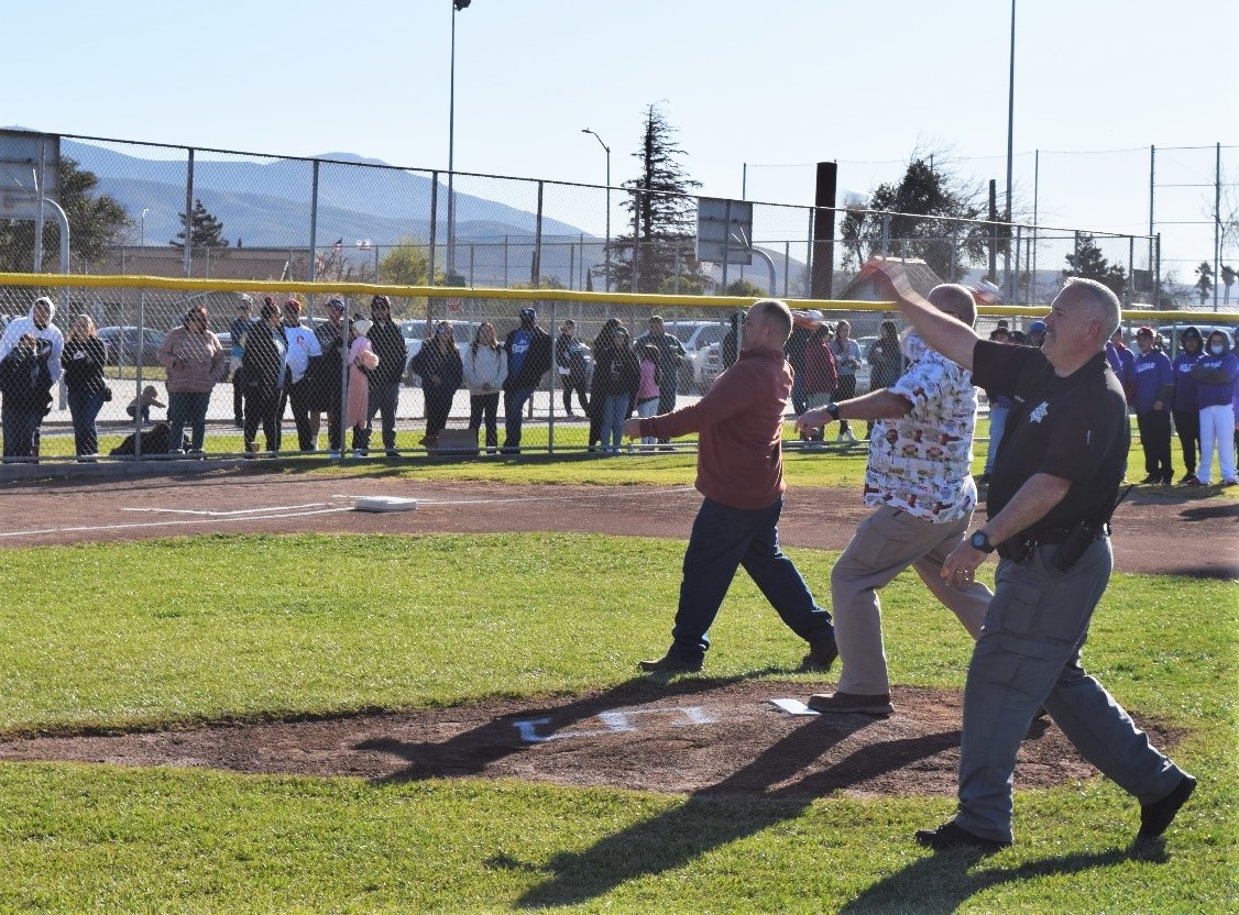 SVSP warden and police chiefs throw baseball pitches.