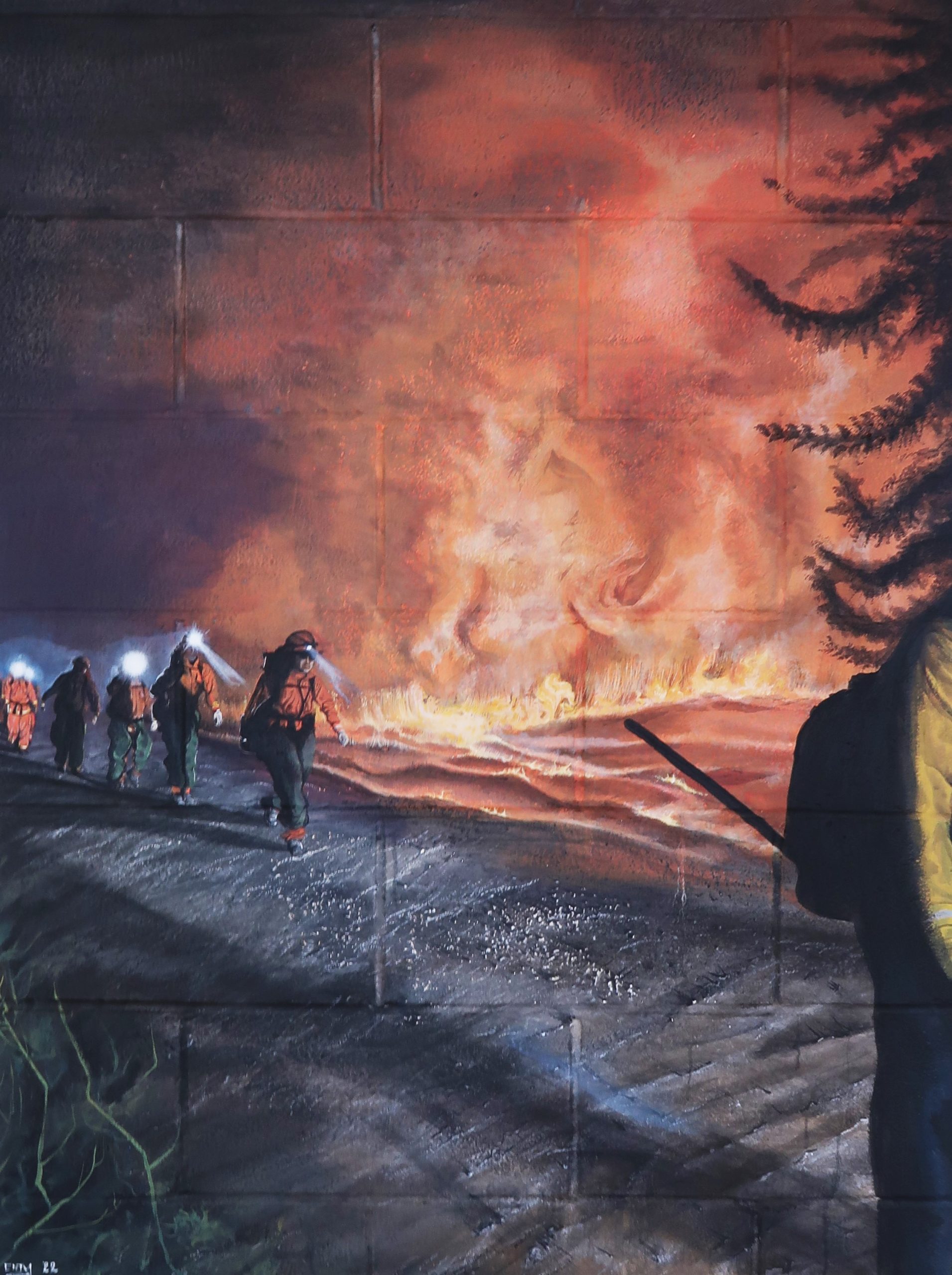 Mural of flames and firefighters.