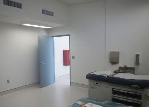 Skilled trades program participants renovated a healthcare room, now updated and modern.