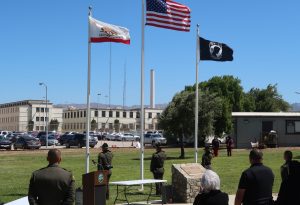 CTF memorial honor guard salutes flag.