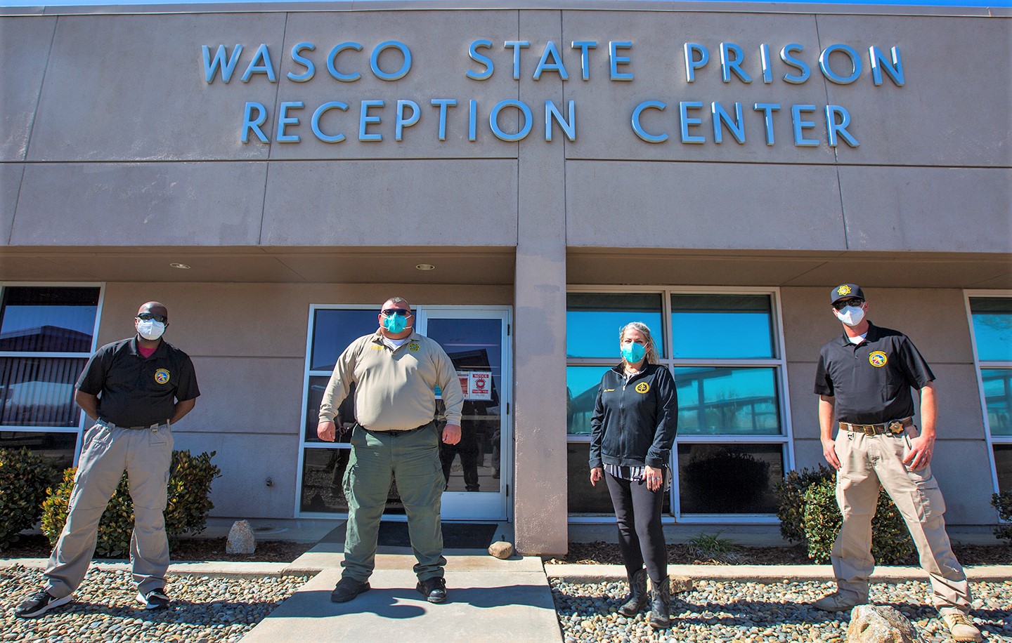 Wasco State Prison Reception Center with four Peer Support members standing in front.
