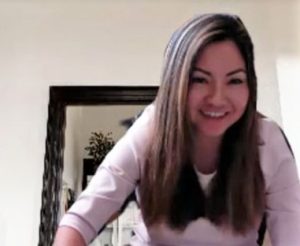 Screen capture of woman giving web presentation.