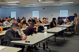 Staff in classroom for mandated visiting training.