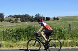 CDCR employee cycling for charity.