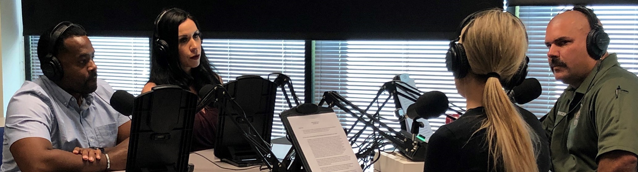 CDCR staff sit in a recording studio. 