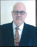 Volker Ghulke wearing glasses and tie.