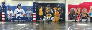 Artwork of sports figures on a Corcoran prison wall.