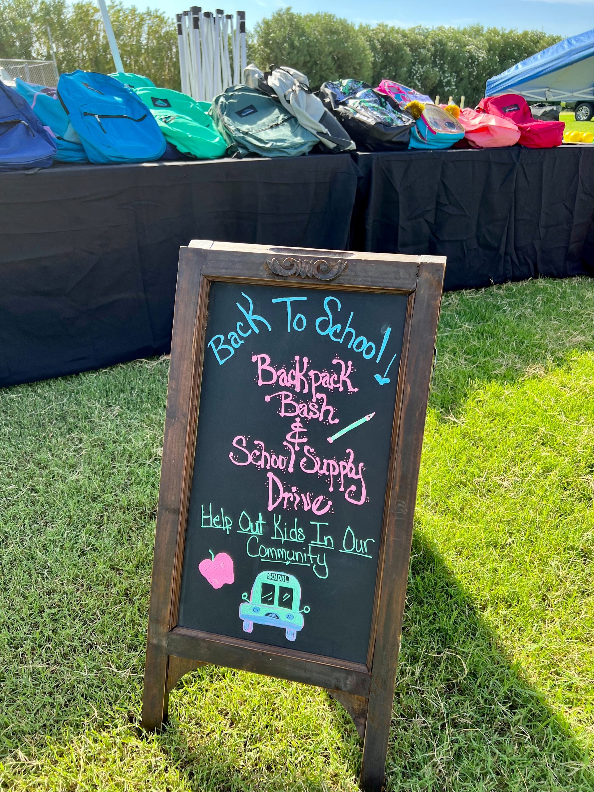 Small sign promoting backpack drive.
