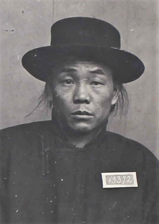 Lee Sing wearing hat with numbers 15372