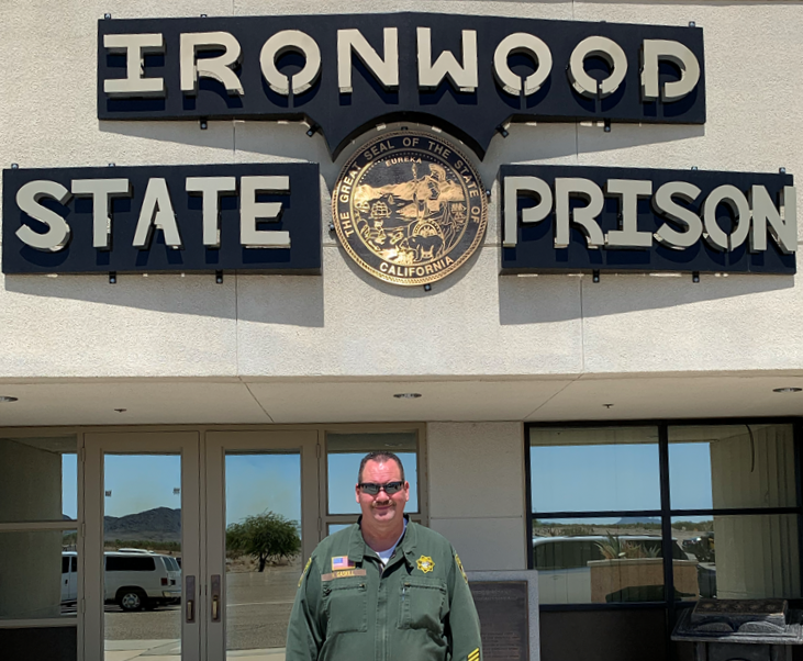 Correctional Officer in front of Ironwood State Prison.