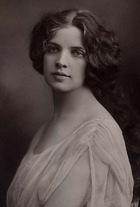 Old photo of woman wearing white blouse.