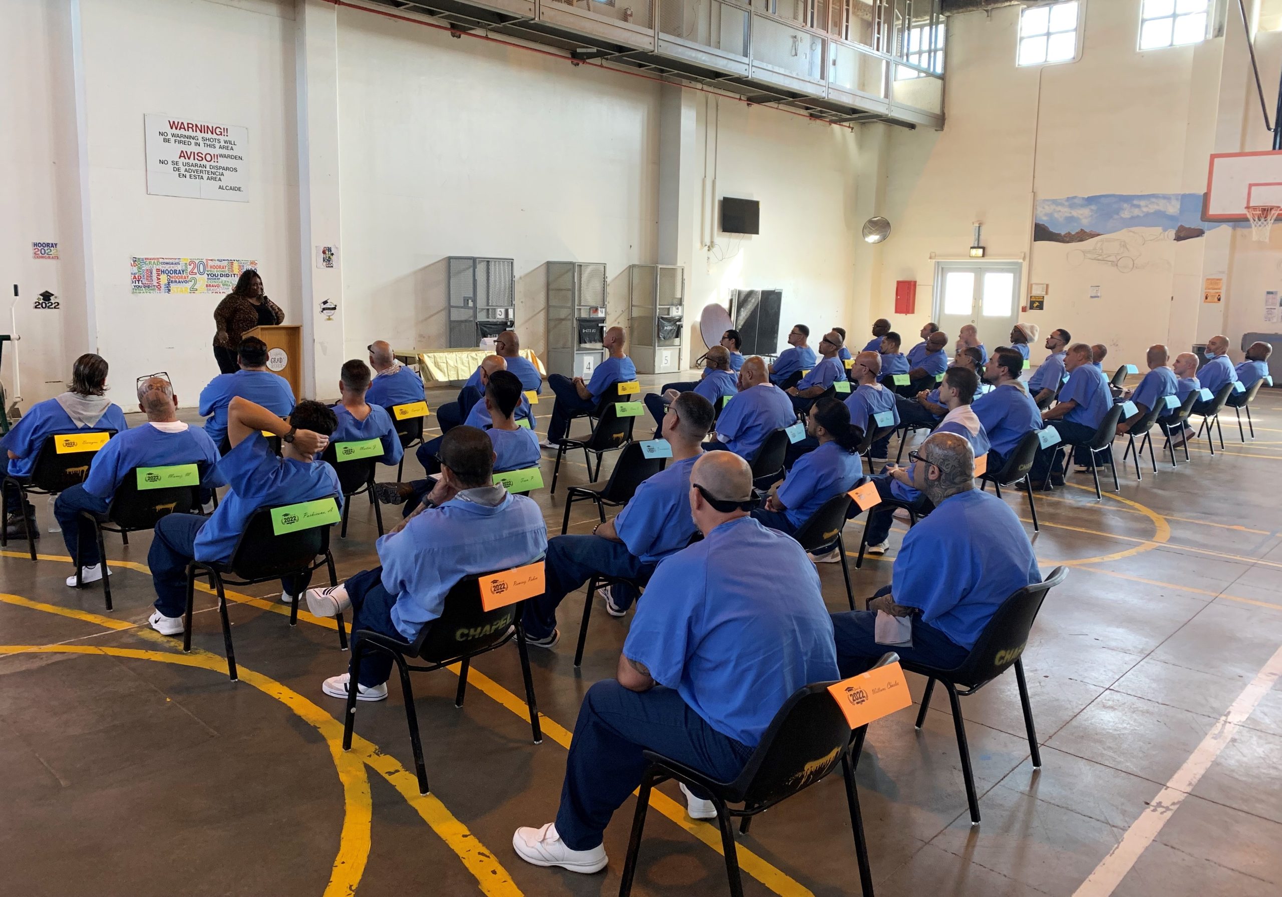 Incarcerated substance use disorder treatment (ISUDT) participants listen to a guest speaker at Centinela prison.