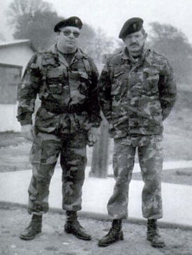 Two men wearing military style fatigues. 