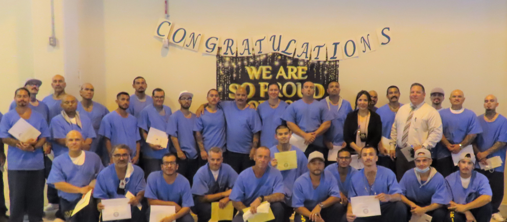ISUDT-CBI participants with "congratulations we are so proud" banners hanging behind them.