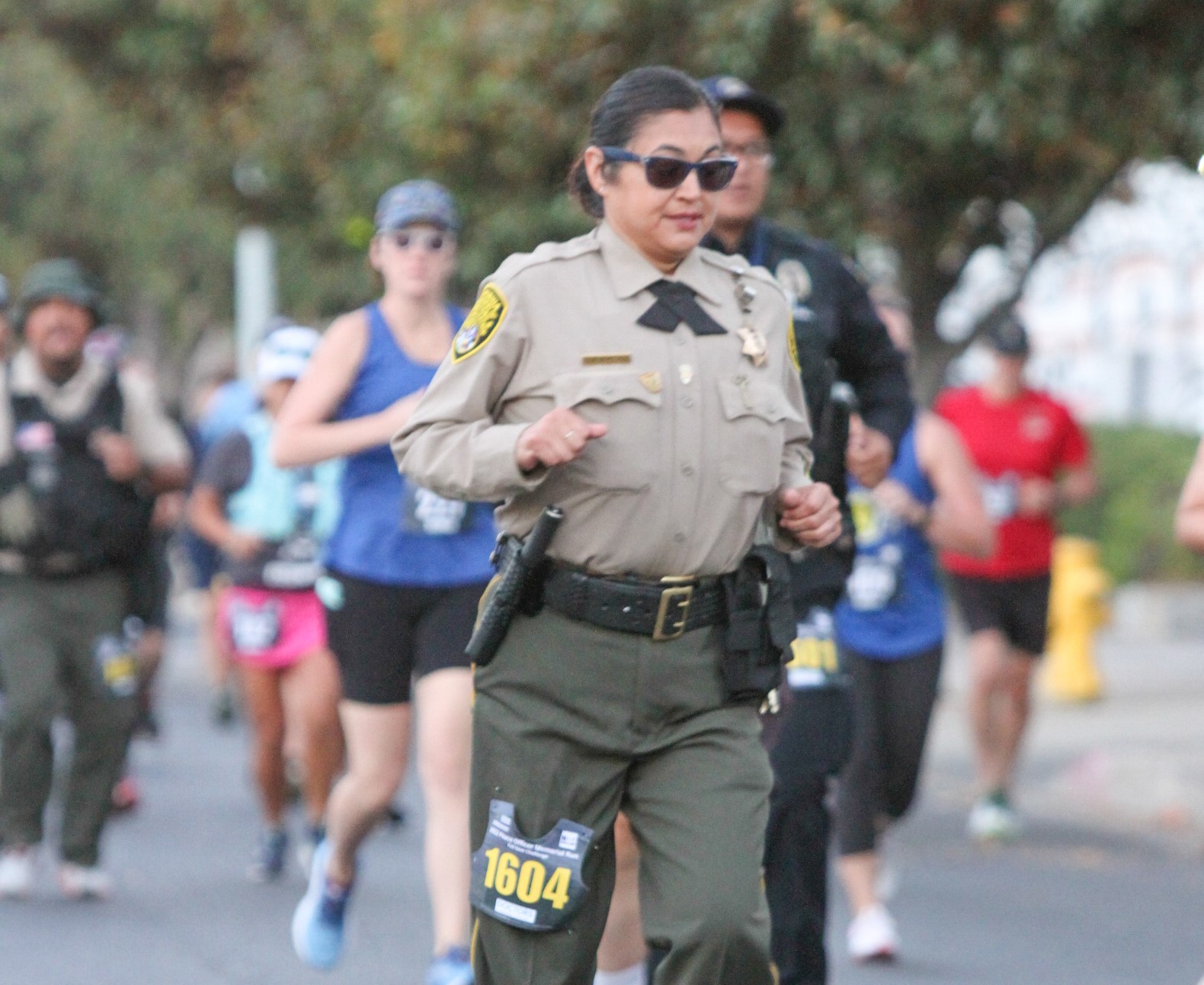 Woman running in uniform.