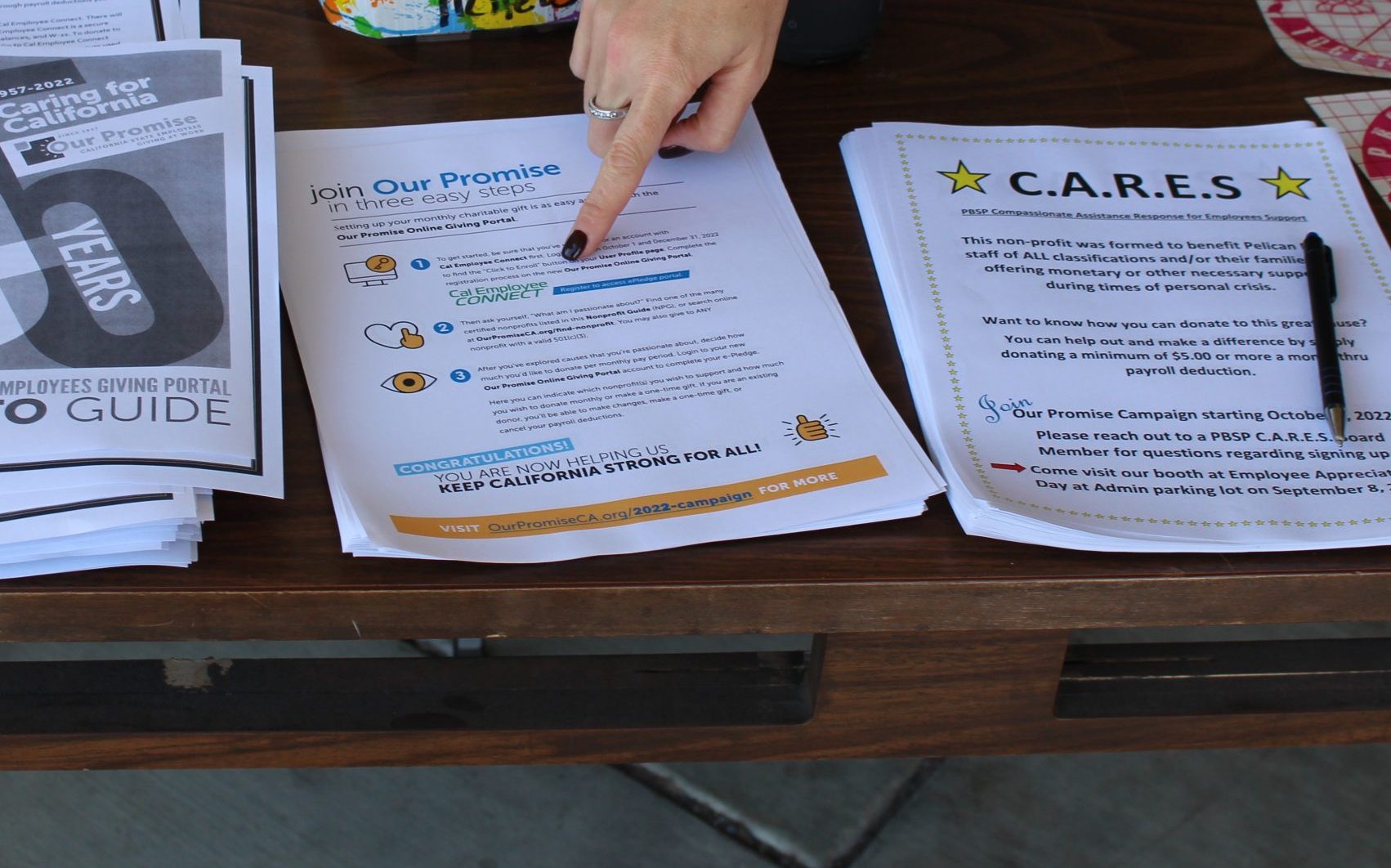 Pelican Bay prison CARES and Our Promise literature on a table.