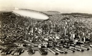 Akron airship dirigible with San Francisco in the background.