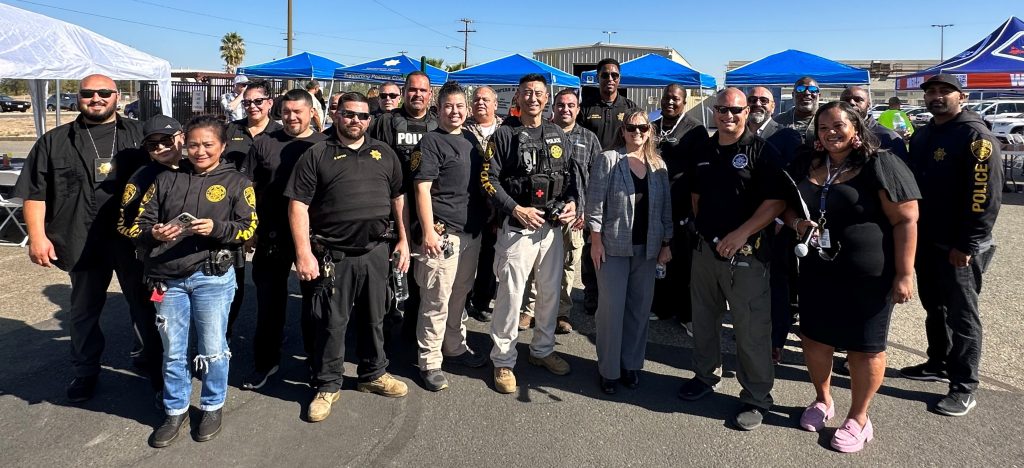 Parole agents in a group shot at a reentry fair.