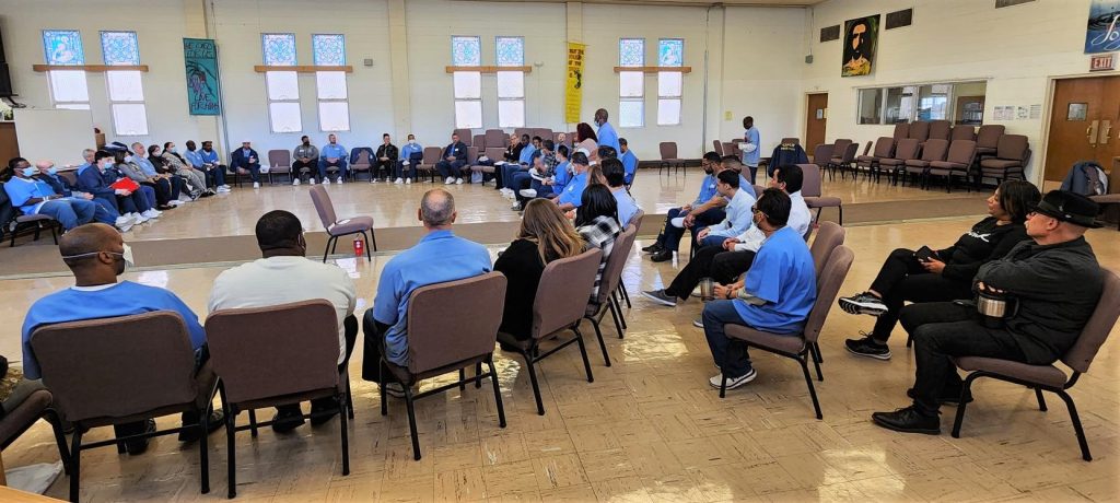 San Quentin incarcerated people sit in a circle in Chapel B.