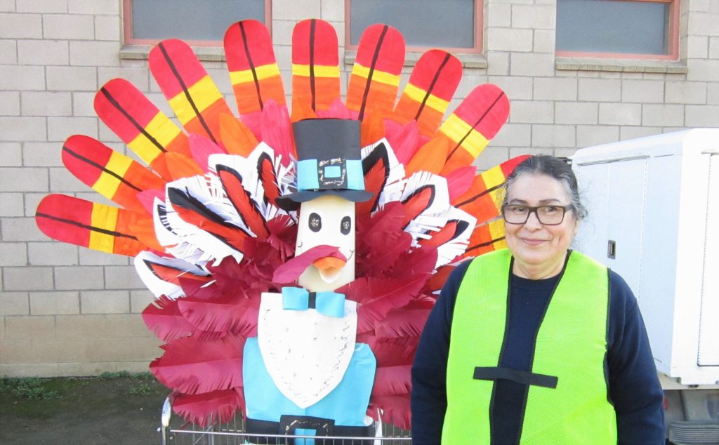 Incarcerated person with a paper turkey Thanksgiving decoration.