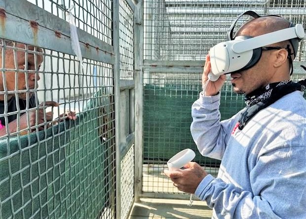 Corcoran prison virtual reality program with one using a headset.
