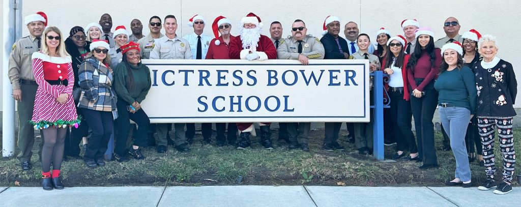 Prison staff and Santa as Victress Bower School.