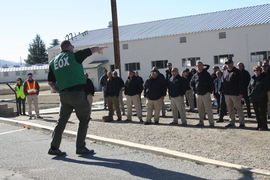 Large group receives directions during training at the prison.