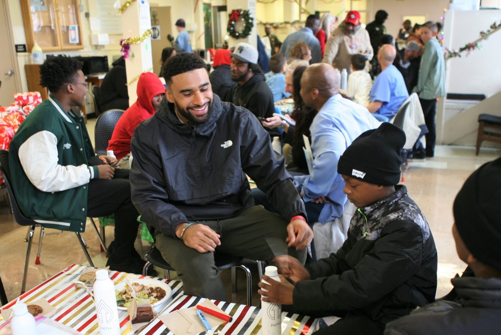 49ers player visits with families of incarcerated men.
