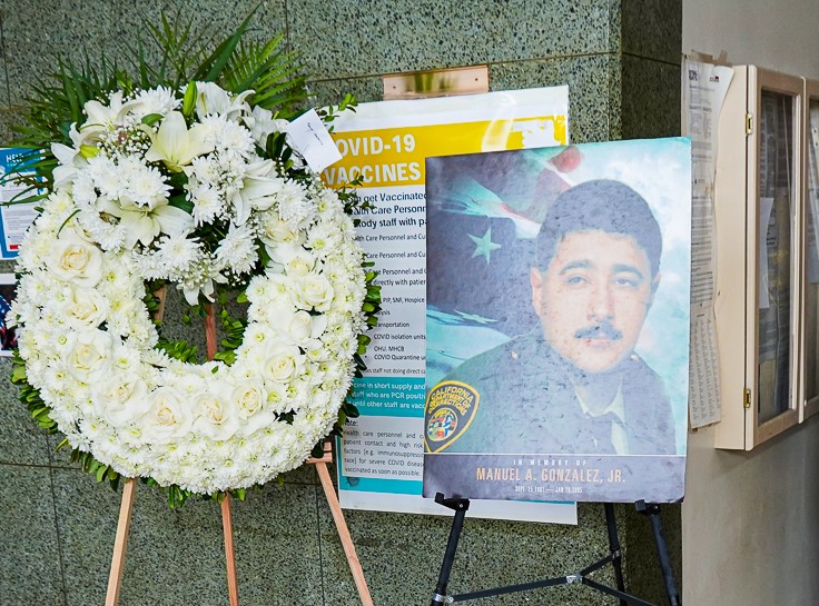Officer Manuel Gonzalez photo with a wreath.