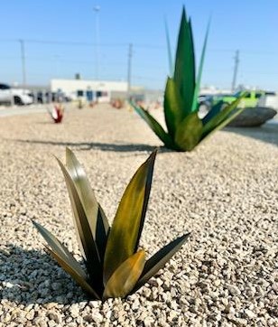 Metal pieces of art appear to be plants.