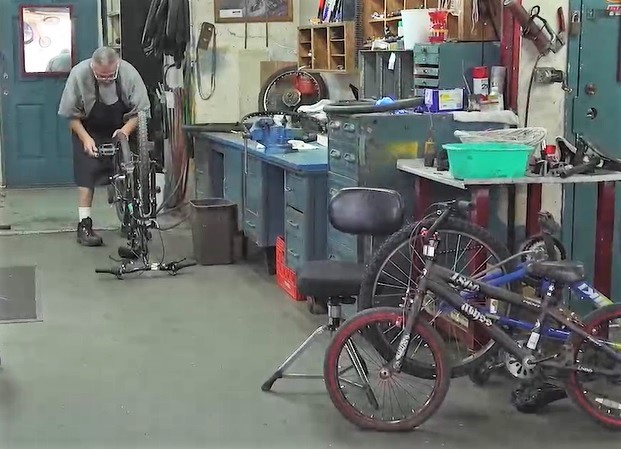 Incarcerated person does bike refurbishing program at Folsom Prison.