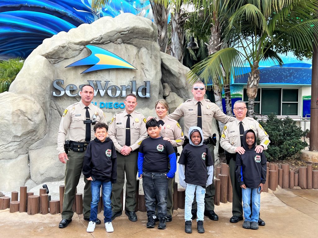 CDCR staff and children at Sea World San Diego.