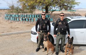 Two Centinela State Prison K-9 officers and their two dogs.