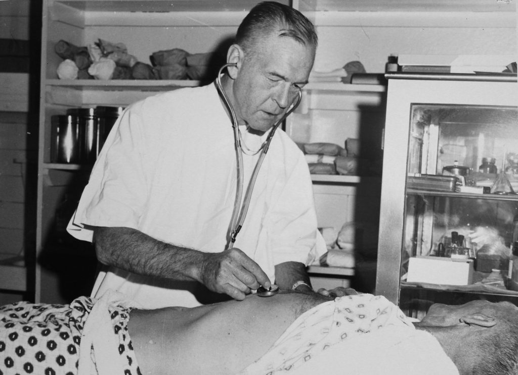 Person uses a stethoscope at California Men's Colony.