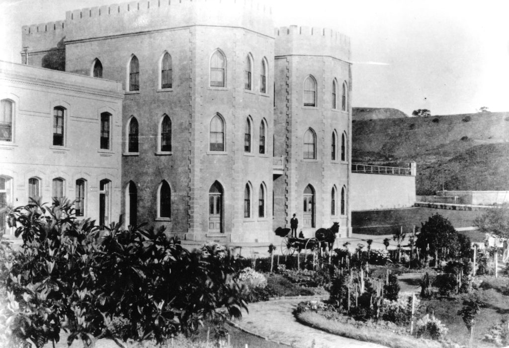 Horse and man in front of San Quentin State Prison in early 1900s.