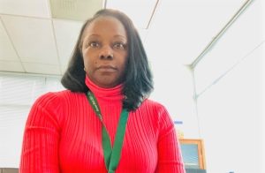 San Quentin CEO Rhonda Litt sitting at her computer.